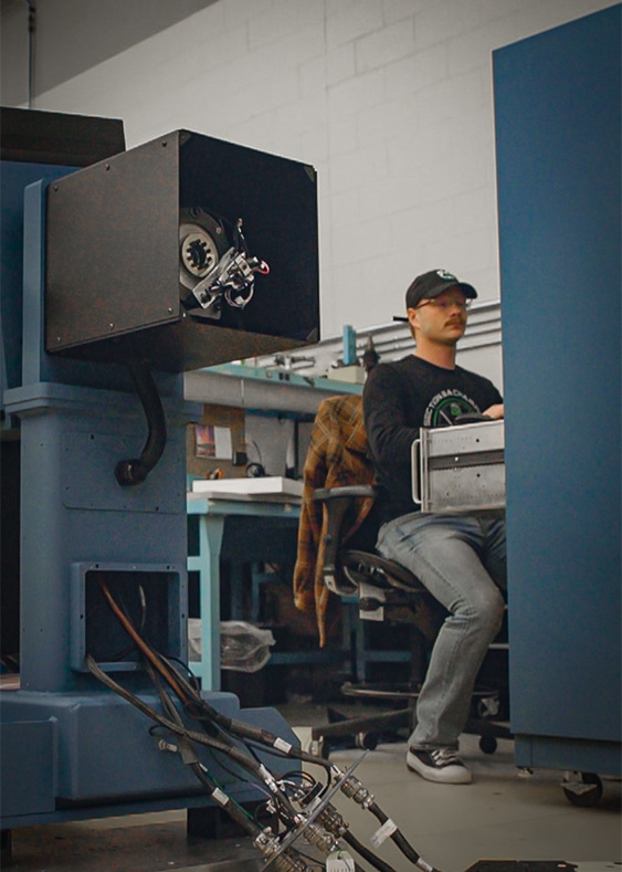 Learn more about us. Ideal Aerosmith Employee Working.